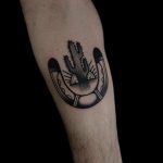 Cactus and horseshoe tattoo