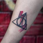 Colorful deathly hallows tattoo
