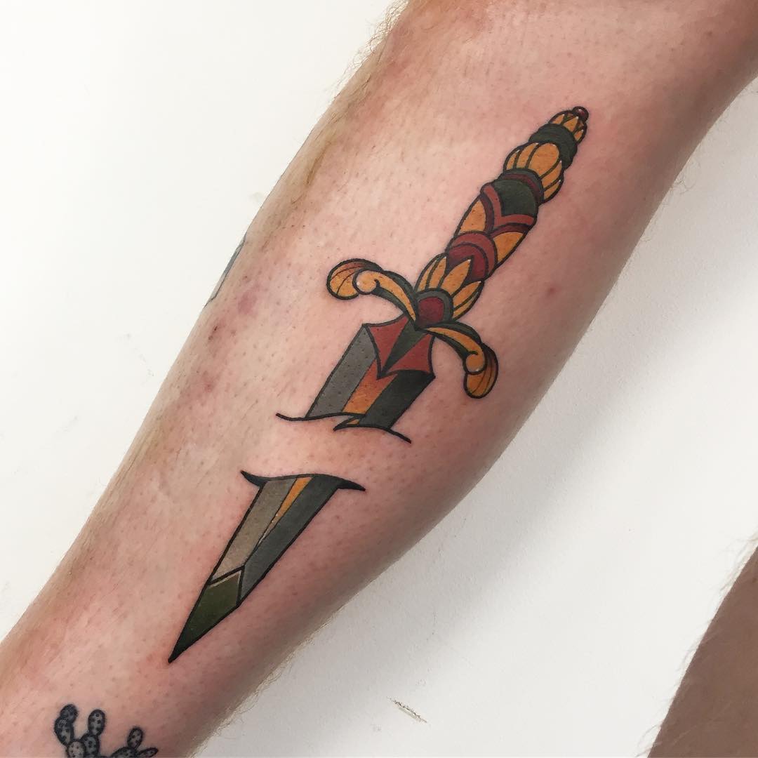 Cool dagger stabbed skin tattoo