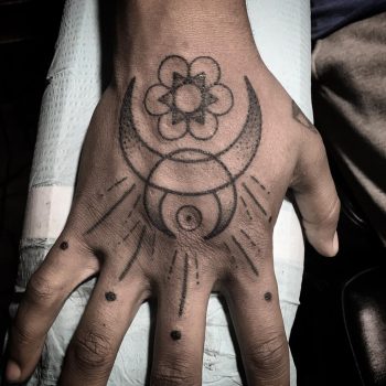 Crescent moon and seed of life tattoo