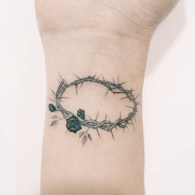 Crown of thorns tattoo on the inner wrist