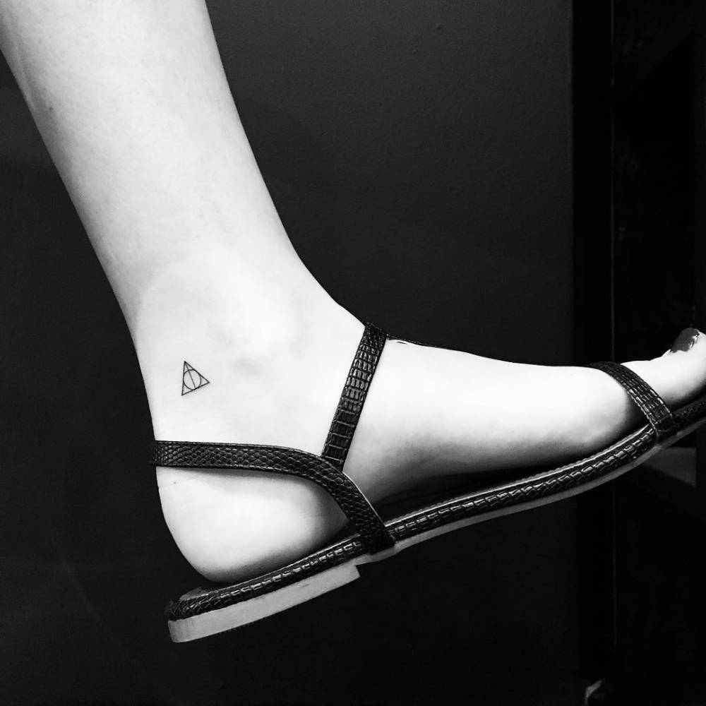 Deathly hallows tattoo on the ankle