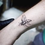 Delicate little bee tattoo