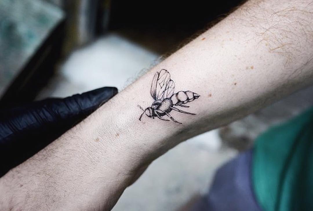 Delicate little bee tattoo