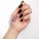 Dices tattoo on the palm