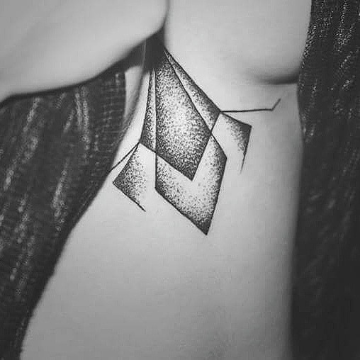 Dot work geometric tattoo on the sternum