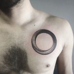 Dotwork circle tattoo on the chest