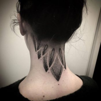 Dotwork ornament tattoo on the neck