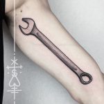 Dotwork wrench tattoo