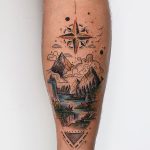 Dreamy landscape and compass rose tattoo