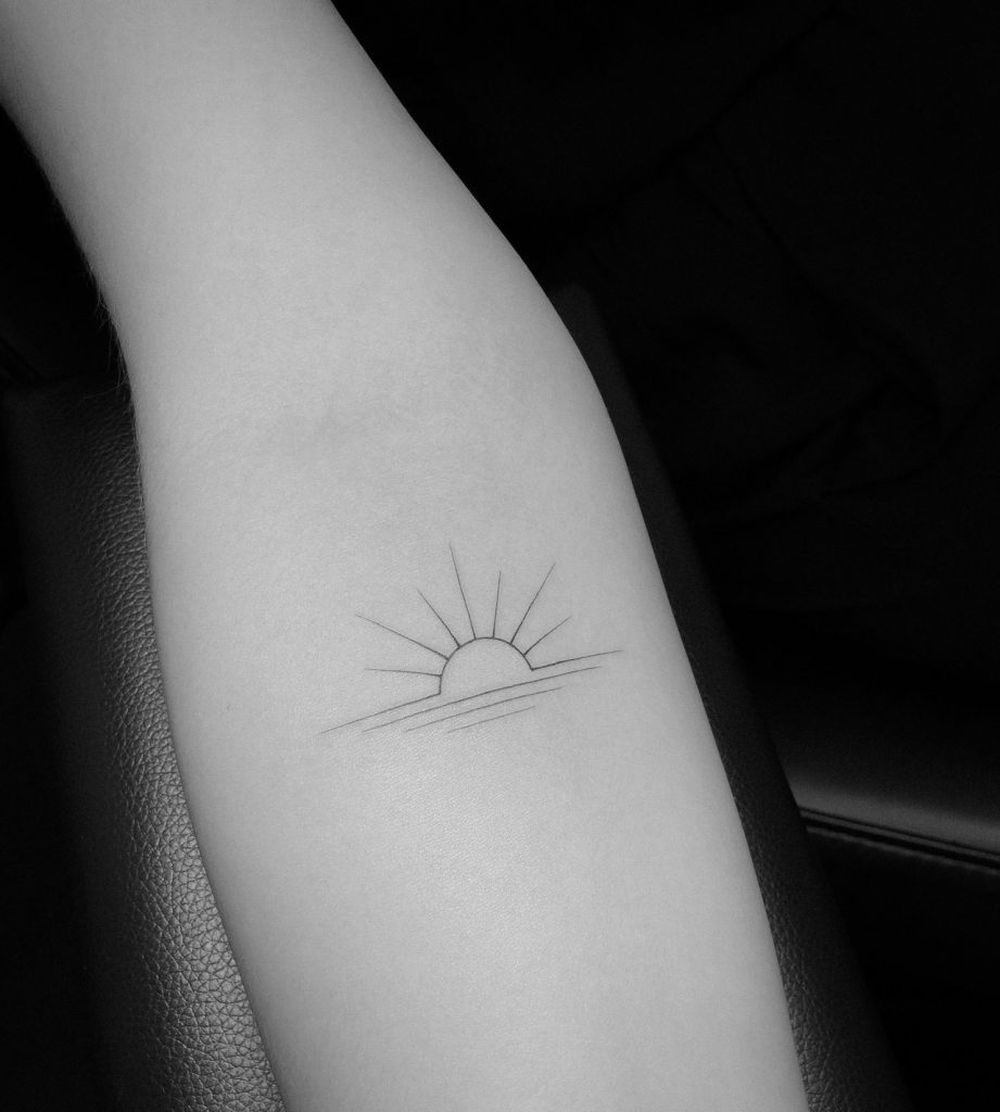 Elegant sunrise tattoo by jakub nowicz