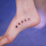 Five lunar phases tattoo on the right foot