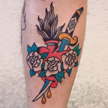 Flaming heart and dagger tattoo