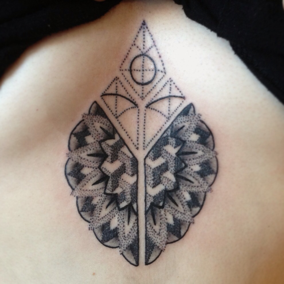 Floral and geometric pattern tattoo