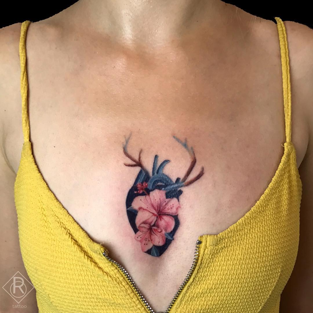 Floral heart sternum tattoo