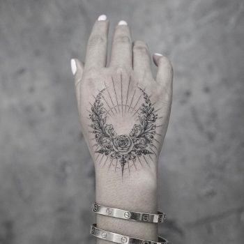 Floral wreath and sunset tattoo