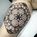 Flower of life tattoo on the right bicep