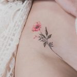 Flower tattoo on the right hip