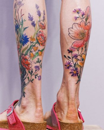 Flower tattoos on both calves