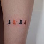Four small cats tattoo