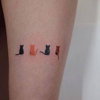 Four small cats tattoo