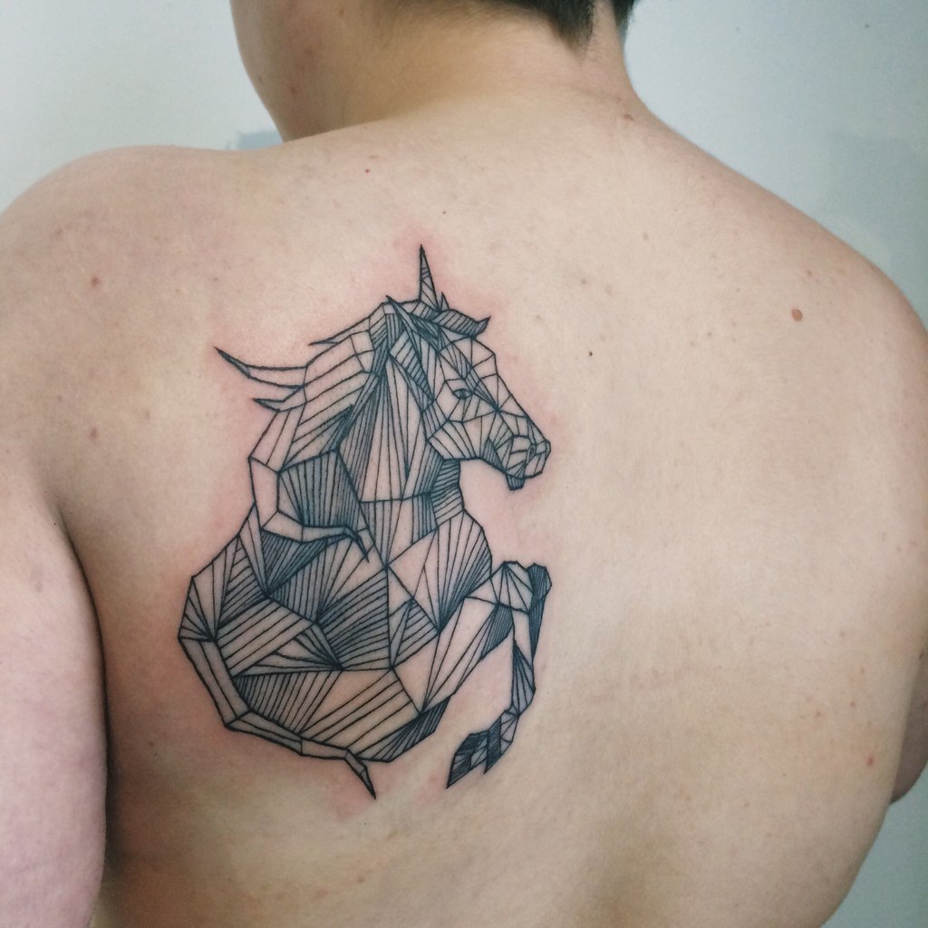 Geometric linear horse tattoo