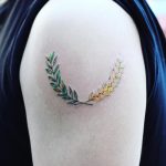 Green and yellow wheat twigs tattoo by yuni