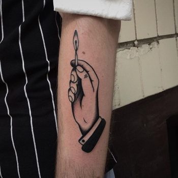 Hand holding a match