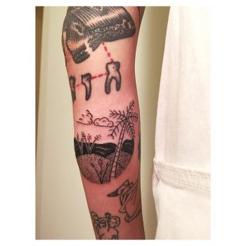 Hand poked beach scene tattoo