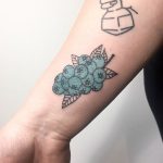 Hand poked blueberries tattoo