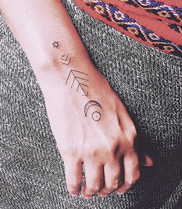 Hand poked ornament tattoo by julia lola