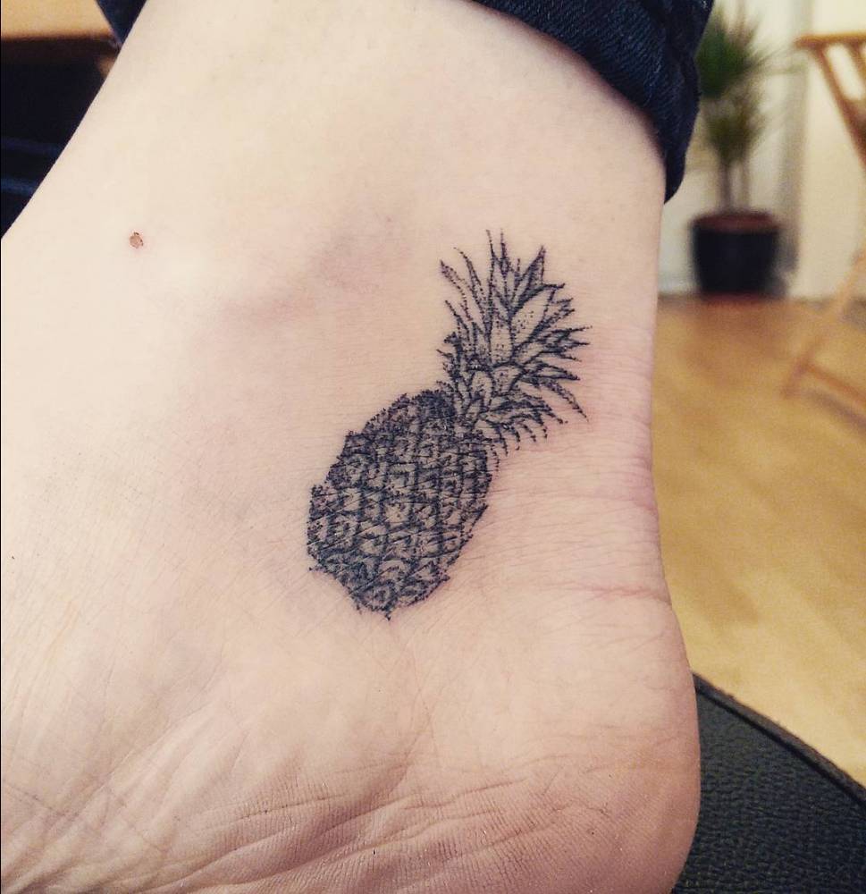Hand poked pineapple tattoo on the ankle
