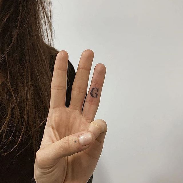 Handpoked g tattoo by ann pokes