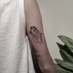 Hands with flowers tattoo by tattooist berkin dönmez