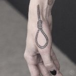 Hangman's noose tattoo on the hand