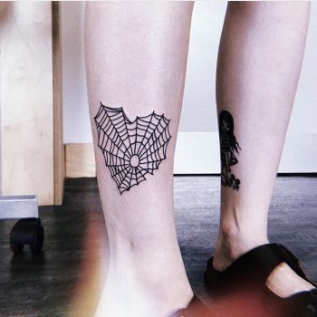 Heart shaped spiderweb tattoo