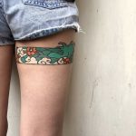 Japanese wave tattoo on the thigh