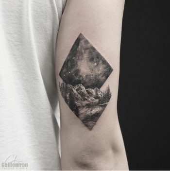 Landscape and sky tattoo