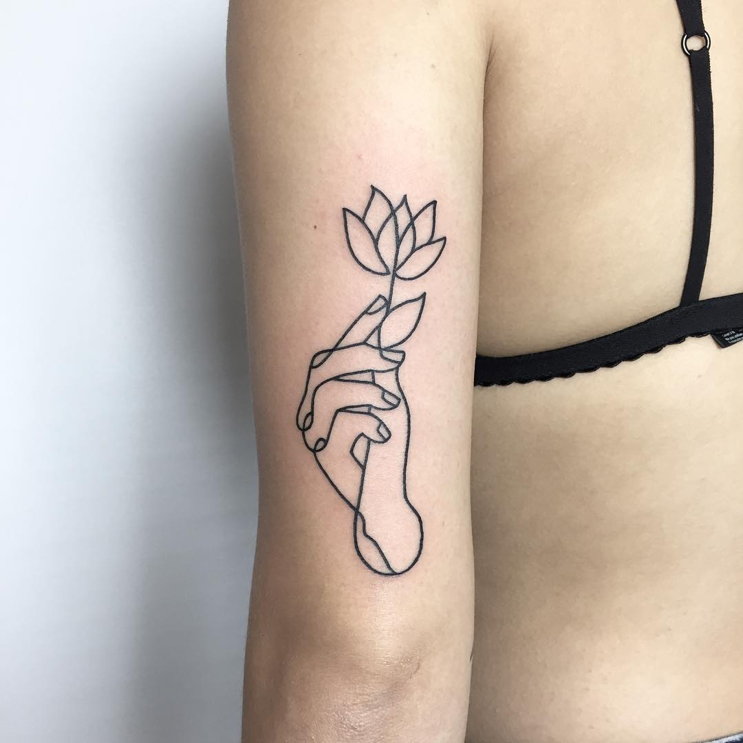 Linework hand and flower tattoo