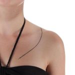 Long thin line tattoo on the collarbone