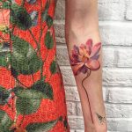 Lotus flower tattoo on the forearm