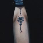 Lotus flower tattoo on the sternum