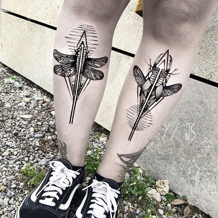 Matching dragonfly tattoos on both shins