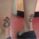 Matching flower tattoos by brunella