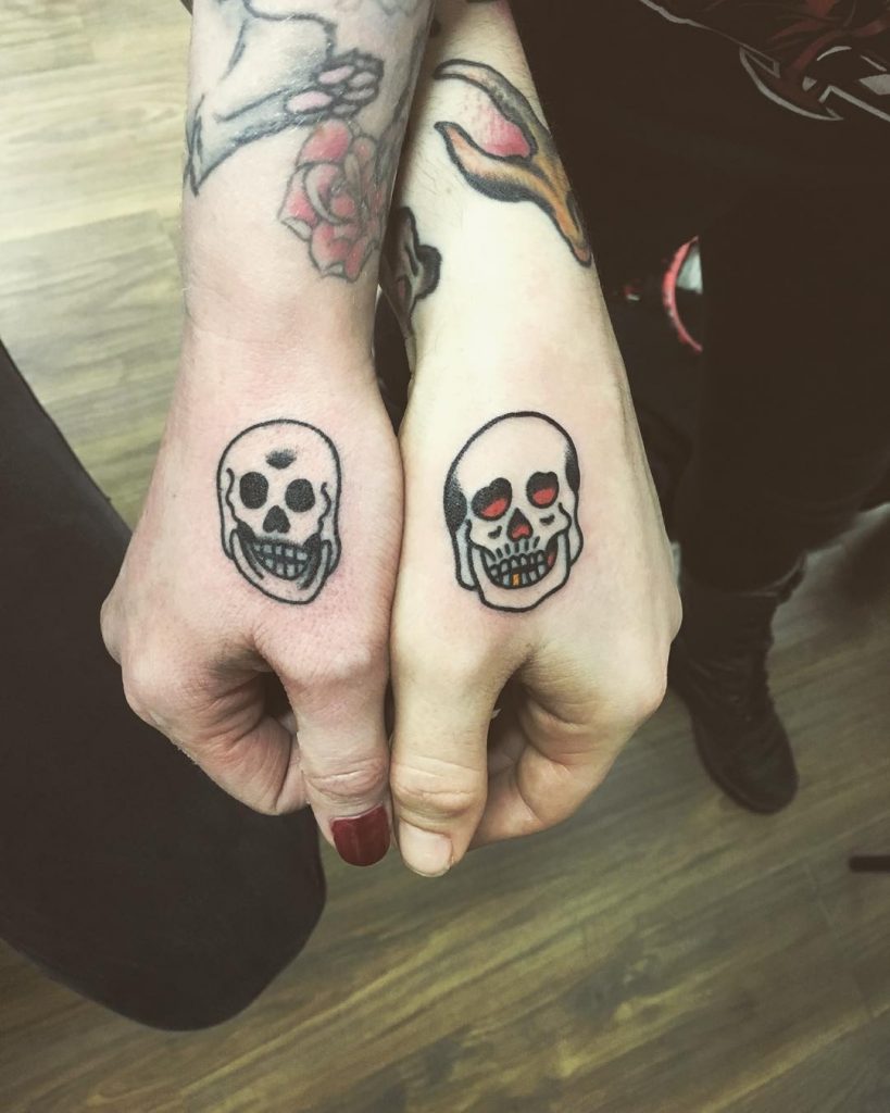 Matching skull tattoos for a couple