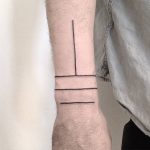Minimalist style linear wrist tattoo