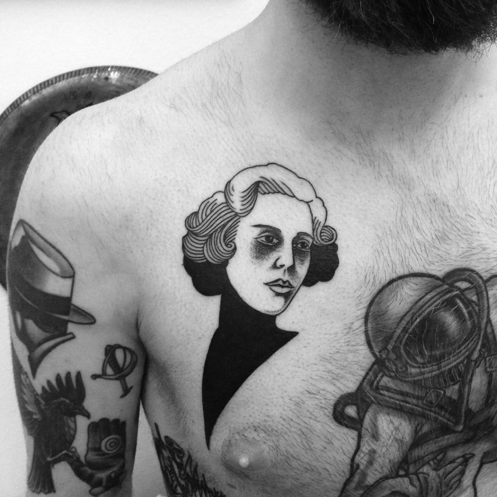 Hand and candle tattoo