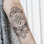 Mystic knot and baroque ornaments tattoo
