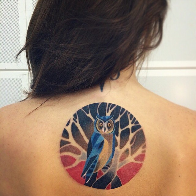 Owl tattoo on the back
