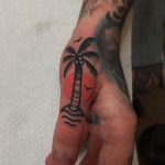 Palm tree tattoo on the thumb